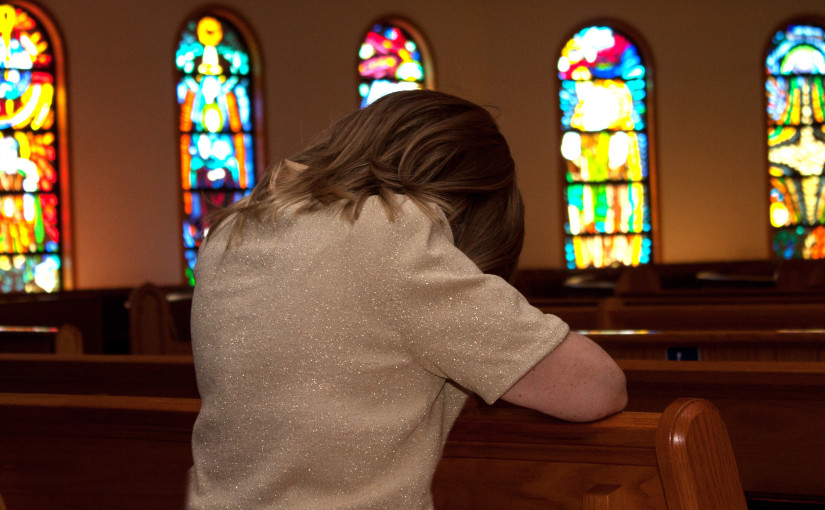 Back view of person at church pew